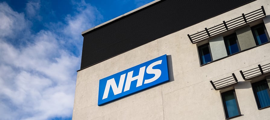 Photo: NHS sign on a building
