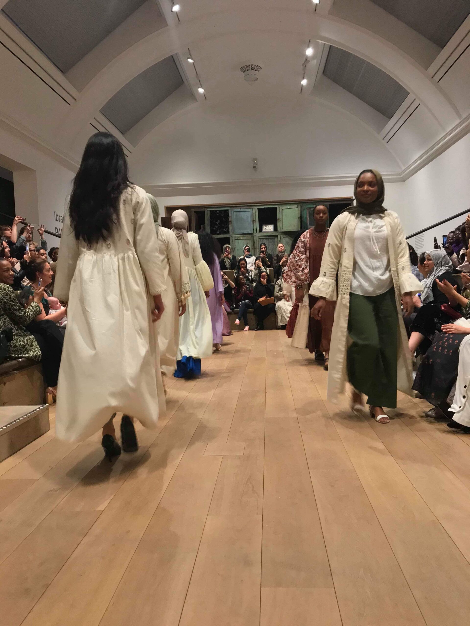 Models walking down catwalk