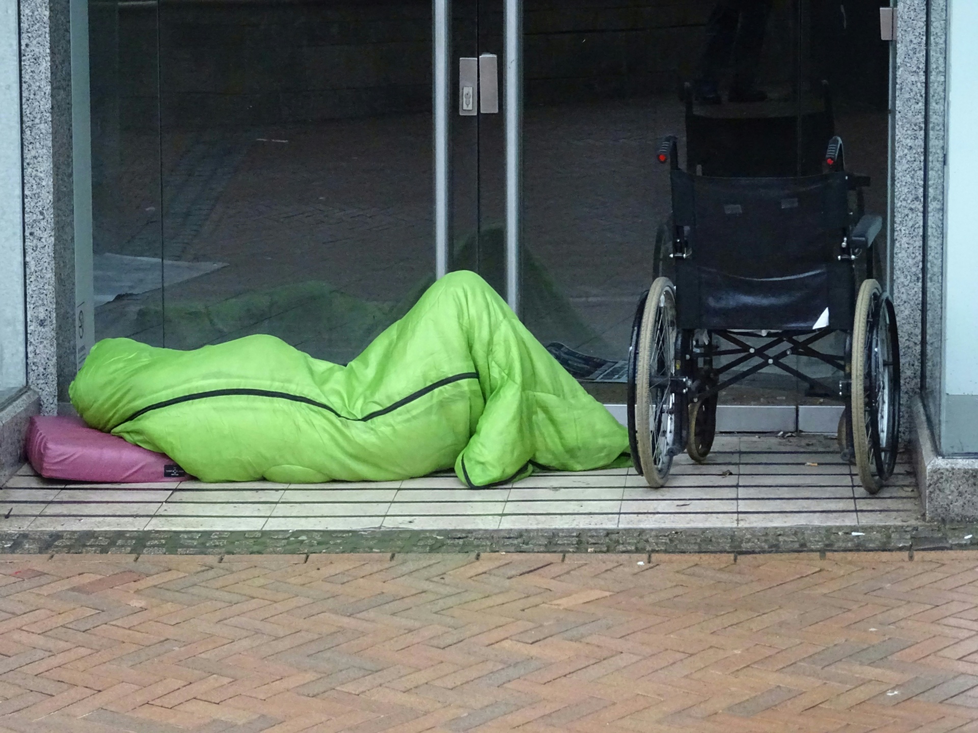 homeless-person-sleeping-in-doorway