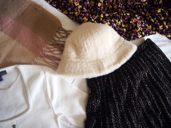 Cream jumper, pleated maxi skirt, floral dress, scarf and fur bucket hat from Primark