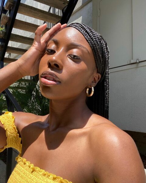 Woman wearing gold hoop earrings