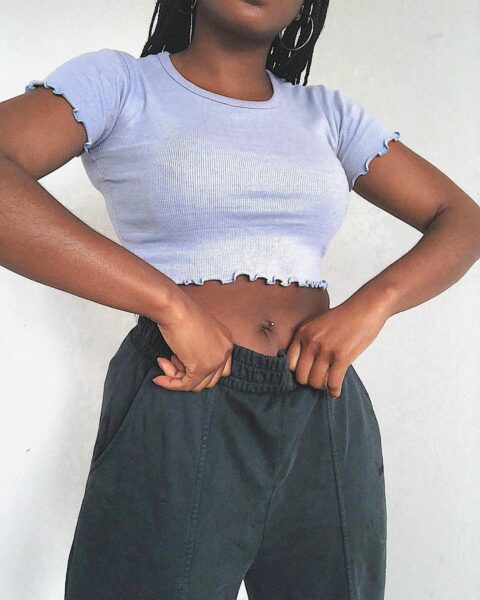 Woman in lettuce hem cropped t-shirt and joggers