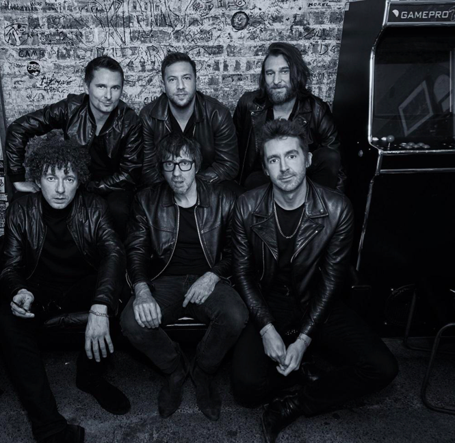 Black and White photograph displays music supergroup, The Jaded Hearts Club