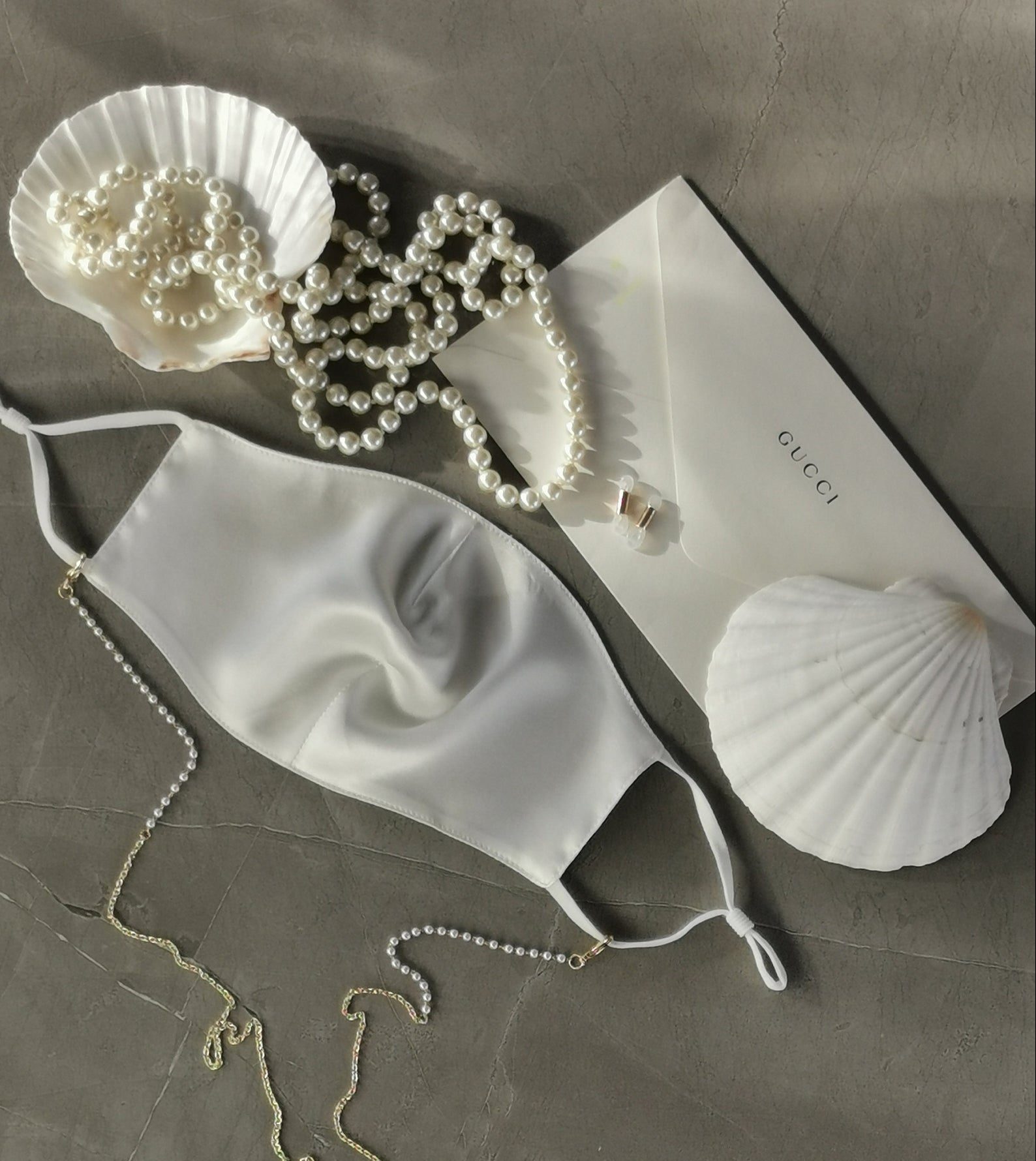 Flatlay featuring a silk face mask