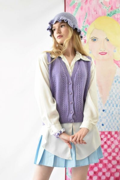 Woman wearing lilac button down vintage sweater vest with shirt