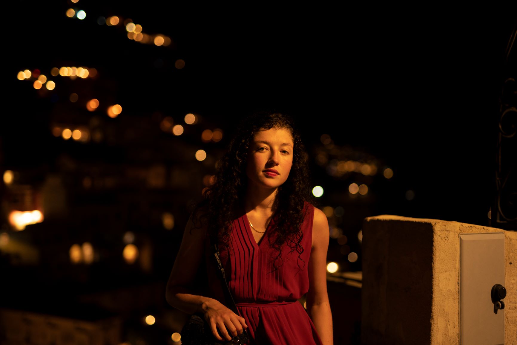 DARK TOWNSCAPE BACKGROUND FEATURING MEDIUM PROFILE SHOT OF GEORGINA DAVIDSON