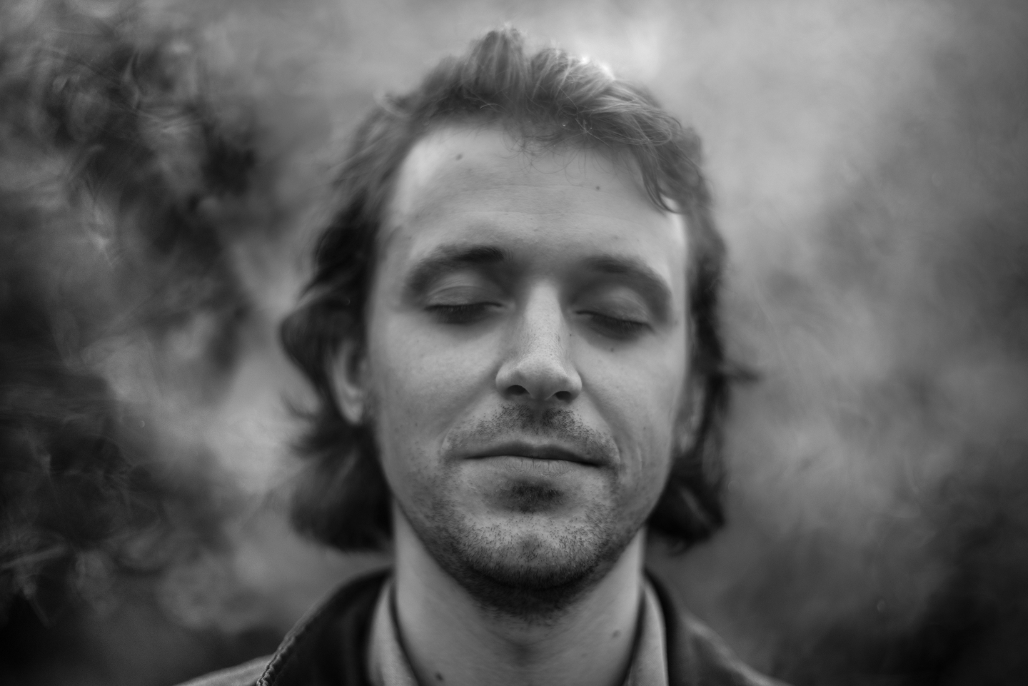 Monochrome image of man with eyes closed