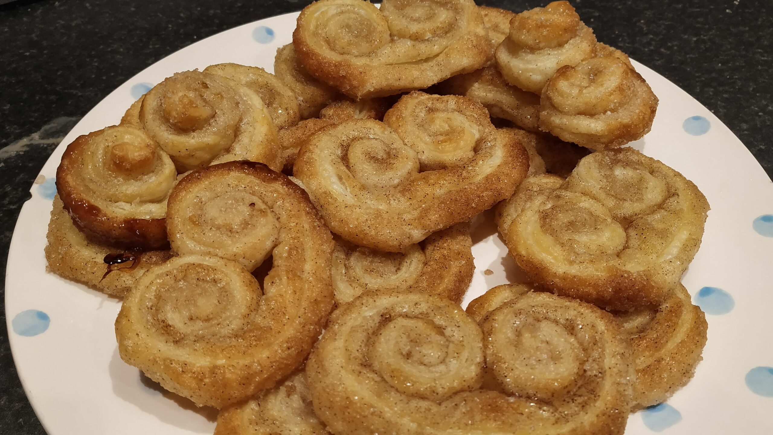 goden palmier pastries on a plate