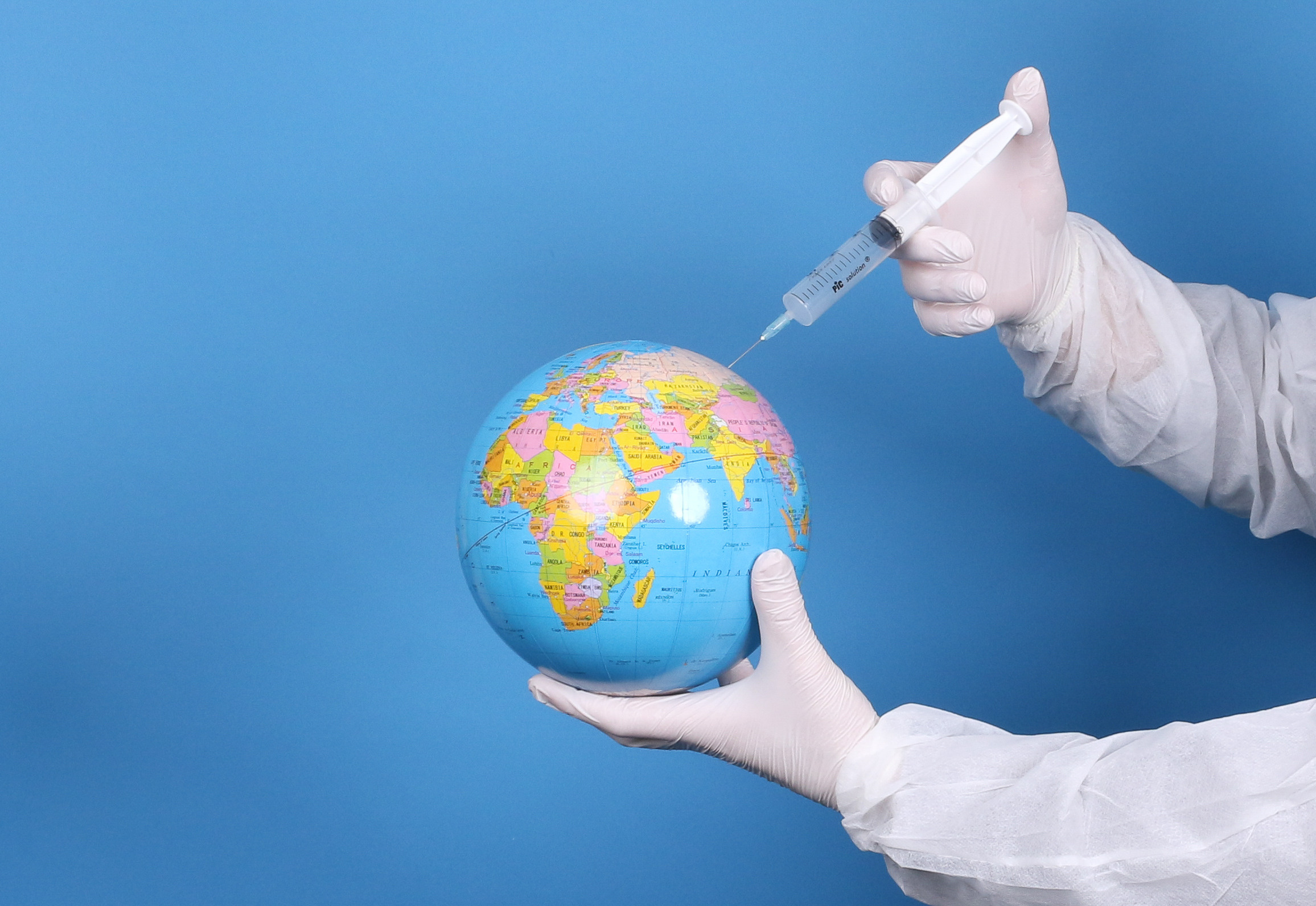 Pandemic concept, close up of scientist injecitng vaccine into t