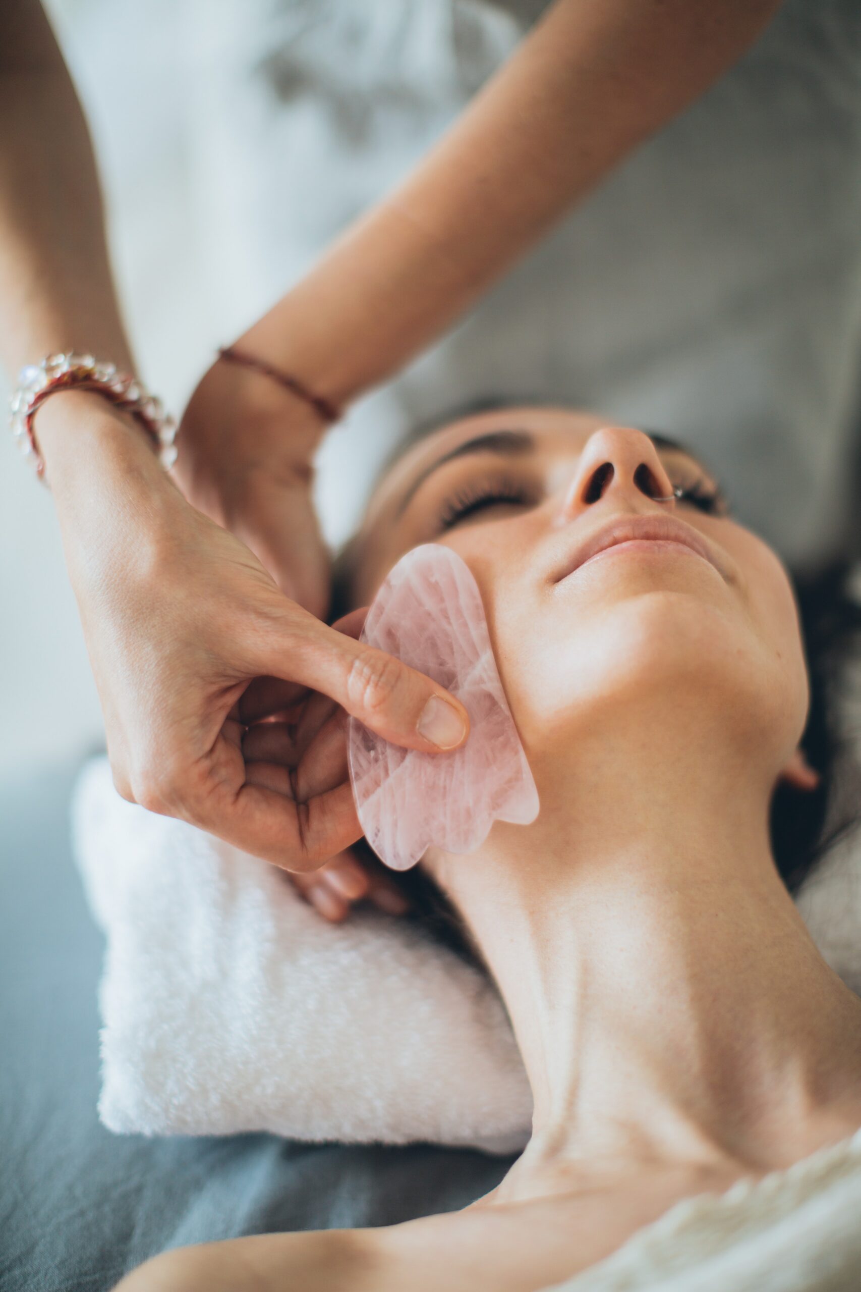 woman using gua share skincare massage