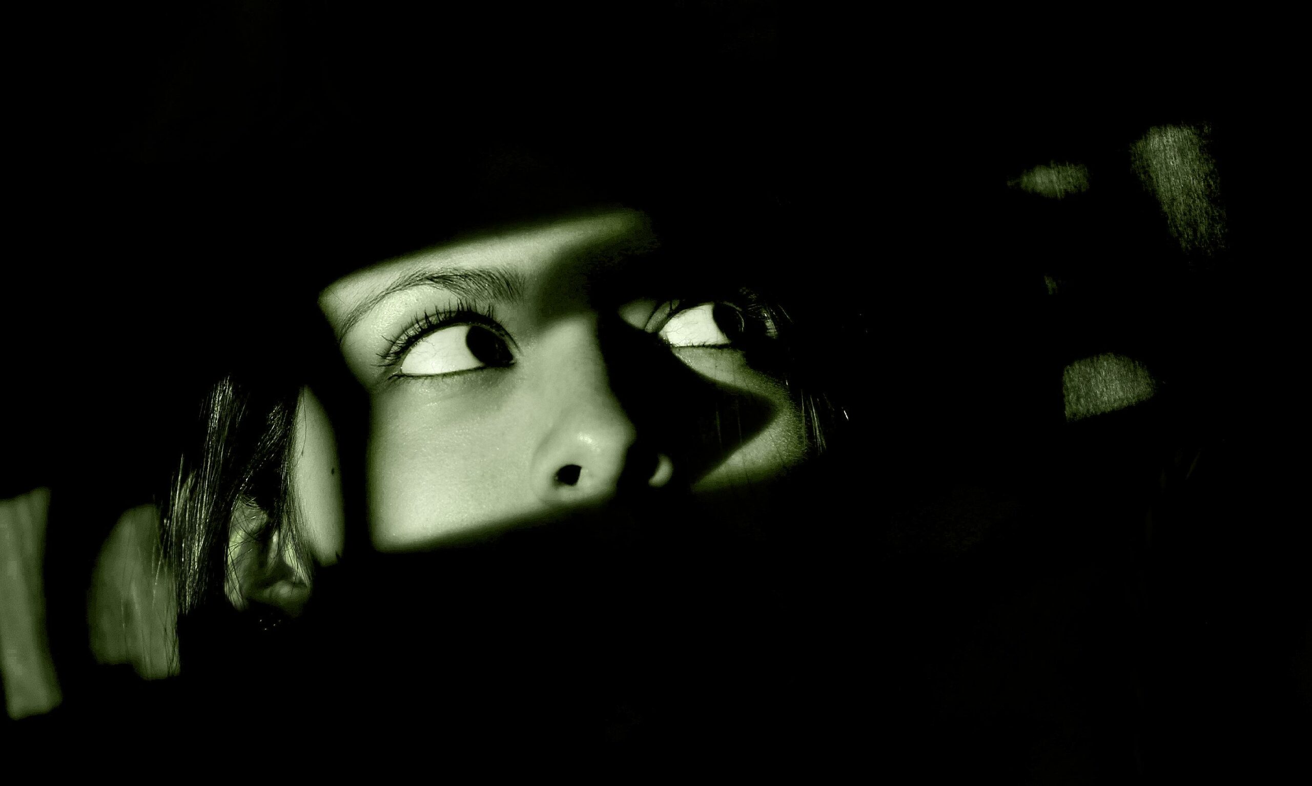 Horror movie themed photo featuring a girl hiding