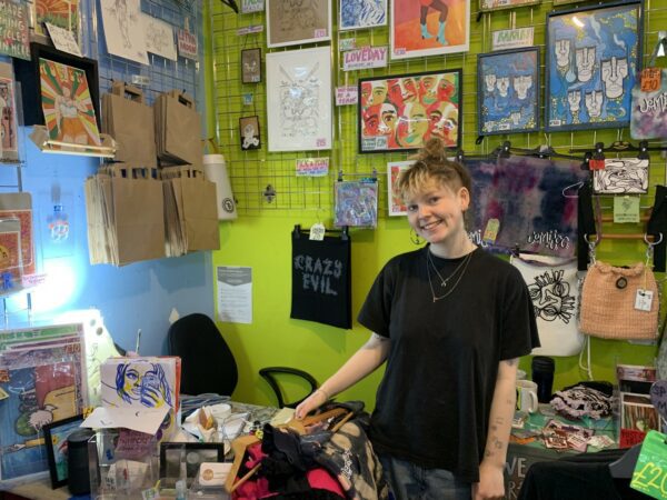 Megan from Trouser Project surrounded by her products