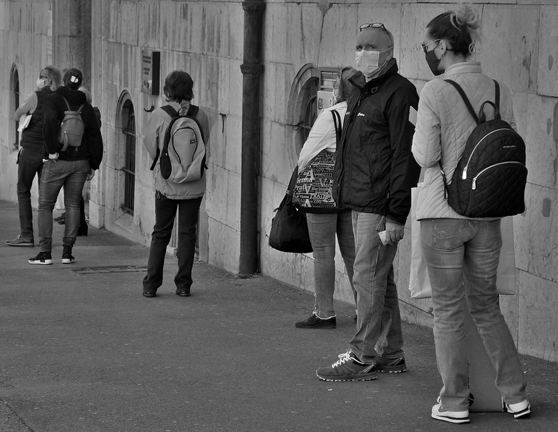 People social distancing in a queue