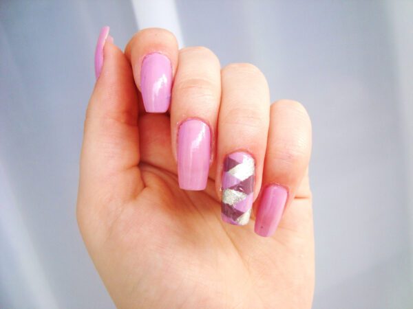 Hand with long pink nails