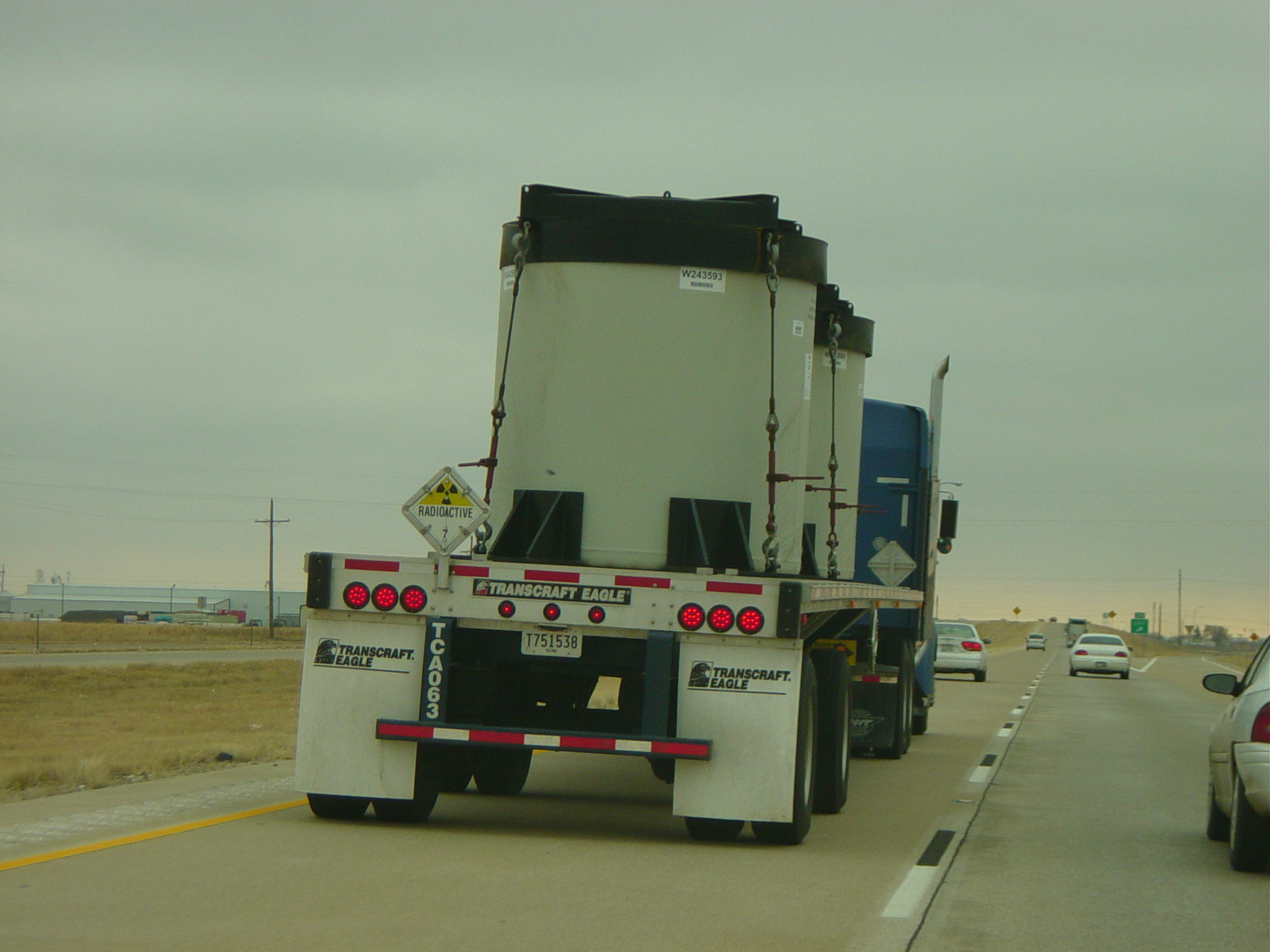 Truck_hauling_two_huge_cannisters_marked_Radioactive