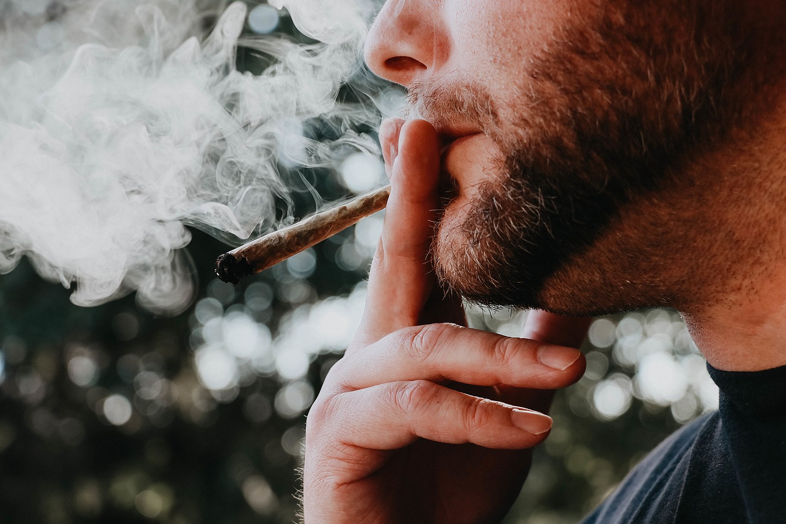Man smoking joint.