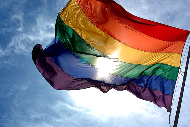 Rainbow Flag And Blue Skies