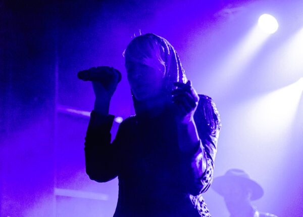 Picture of lead singer Haines singing