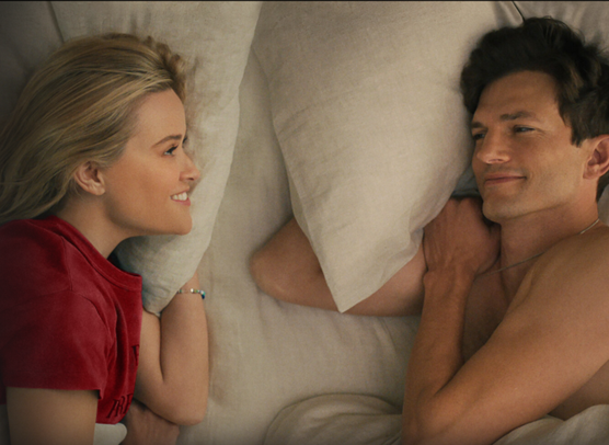 photo of a woman and man lying in bed