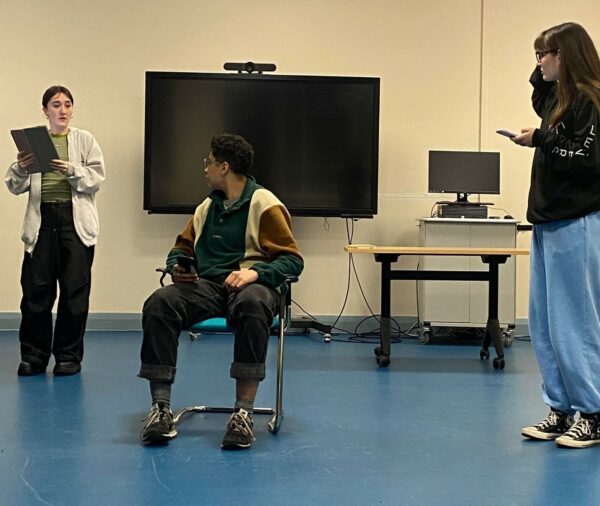 the cast of capital letters rehearshing