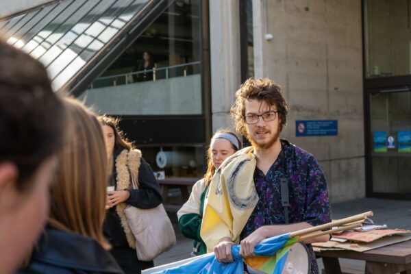 László Molnárfi is pictured on campus at TCD in Dublin with banners for the Book of Kells blockade