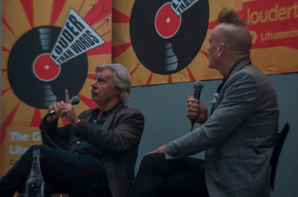 Glen Matlock, left, being interviewed by John Robb, right