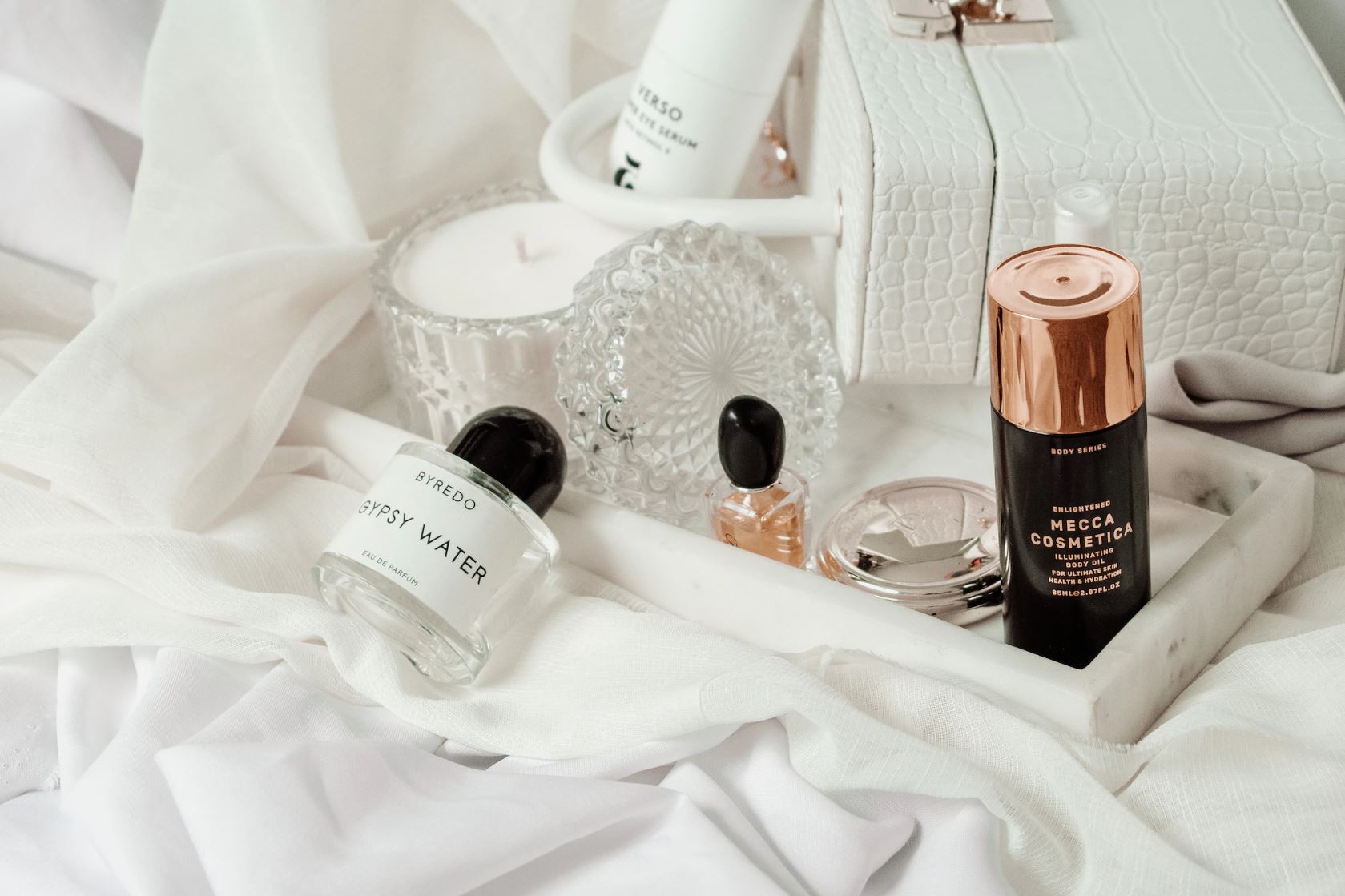 skincare products on a bed