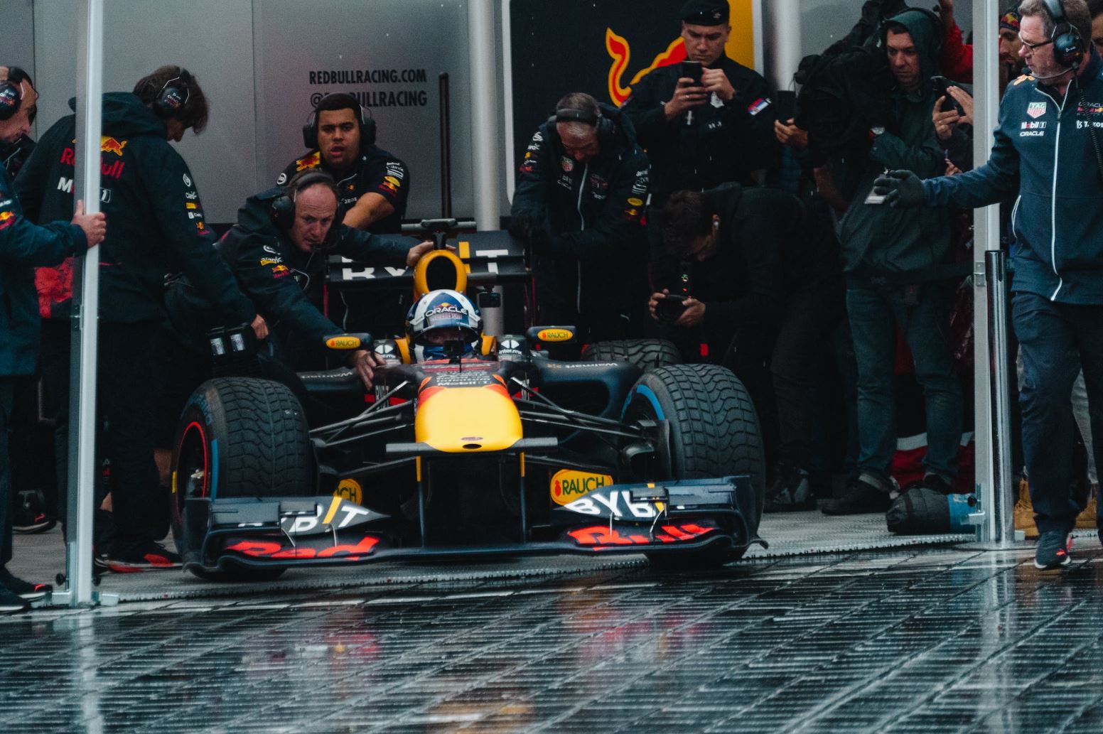 driver in a red bull f1 car