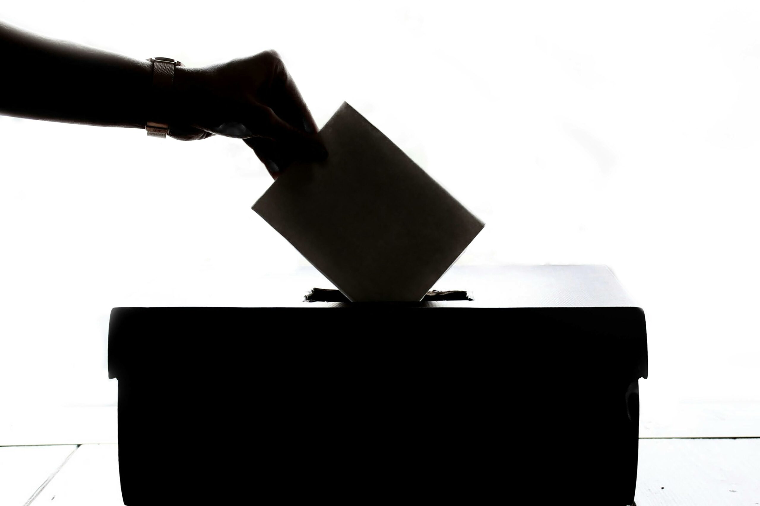 a vote being deposited in a ballot box