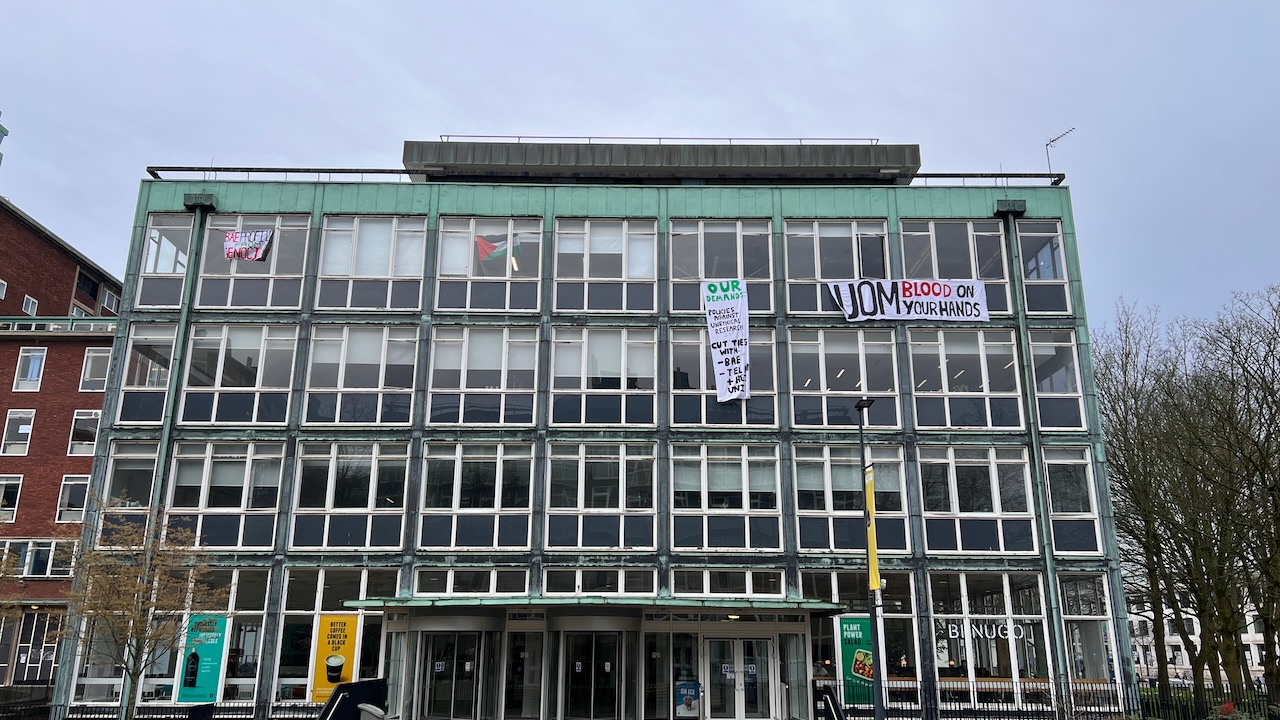The Simon Building, occupied by Manchester Leftist Action, with banners reading 'blood on your hands UOM'