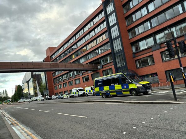 Police vehicles lining up by campus