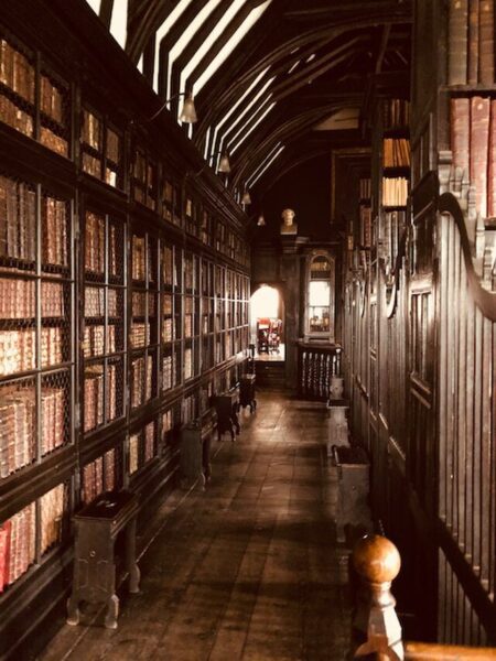 Rows of books line the walls of Chetham's Library, Manchester.