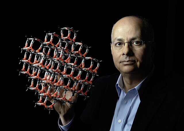 Omar Yaghi, showing a molecular model of a MOF. Photo credit: Christopher Michel @ WikiMedia Commons