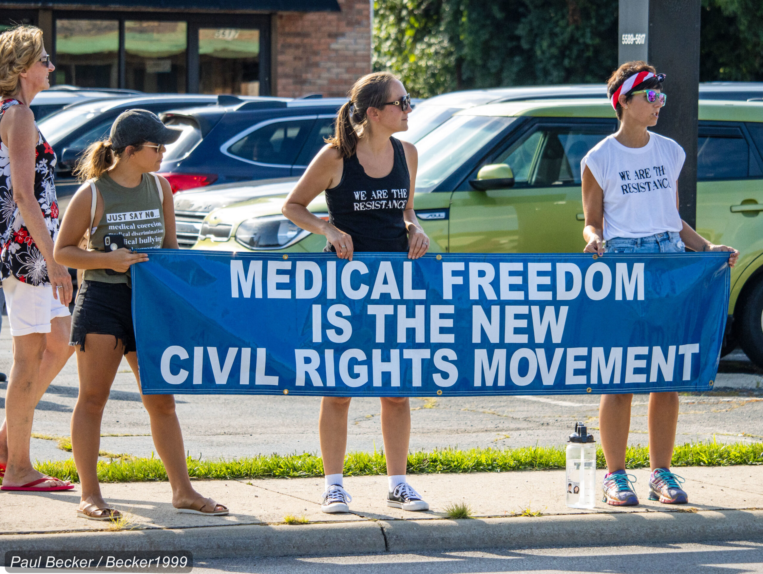 Anti-vaccine protestors with sign