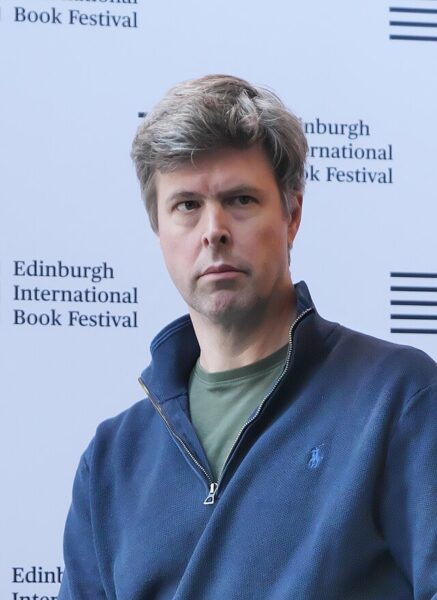 David Szalay against a white backdrop, 