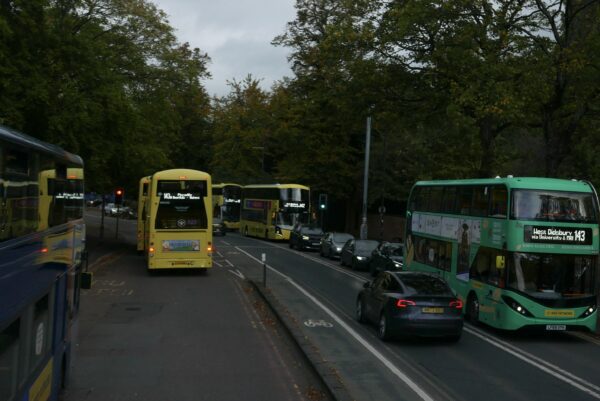 Six buses in congestion near Owen's Park bus stop.