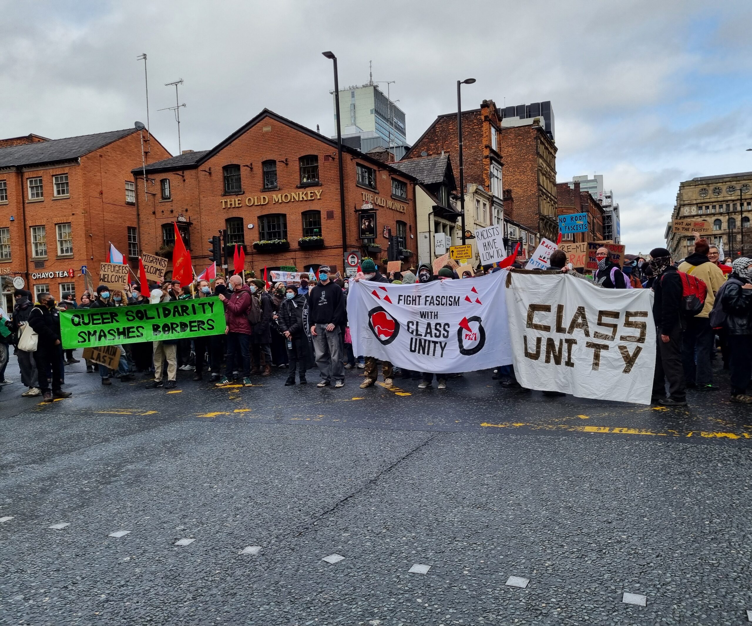 Counter Protests holding banners on Portland/Princess street